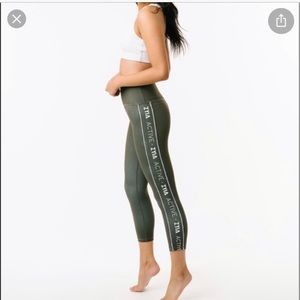 Zyia olive green logo LNT